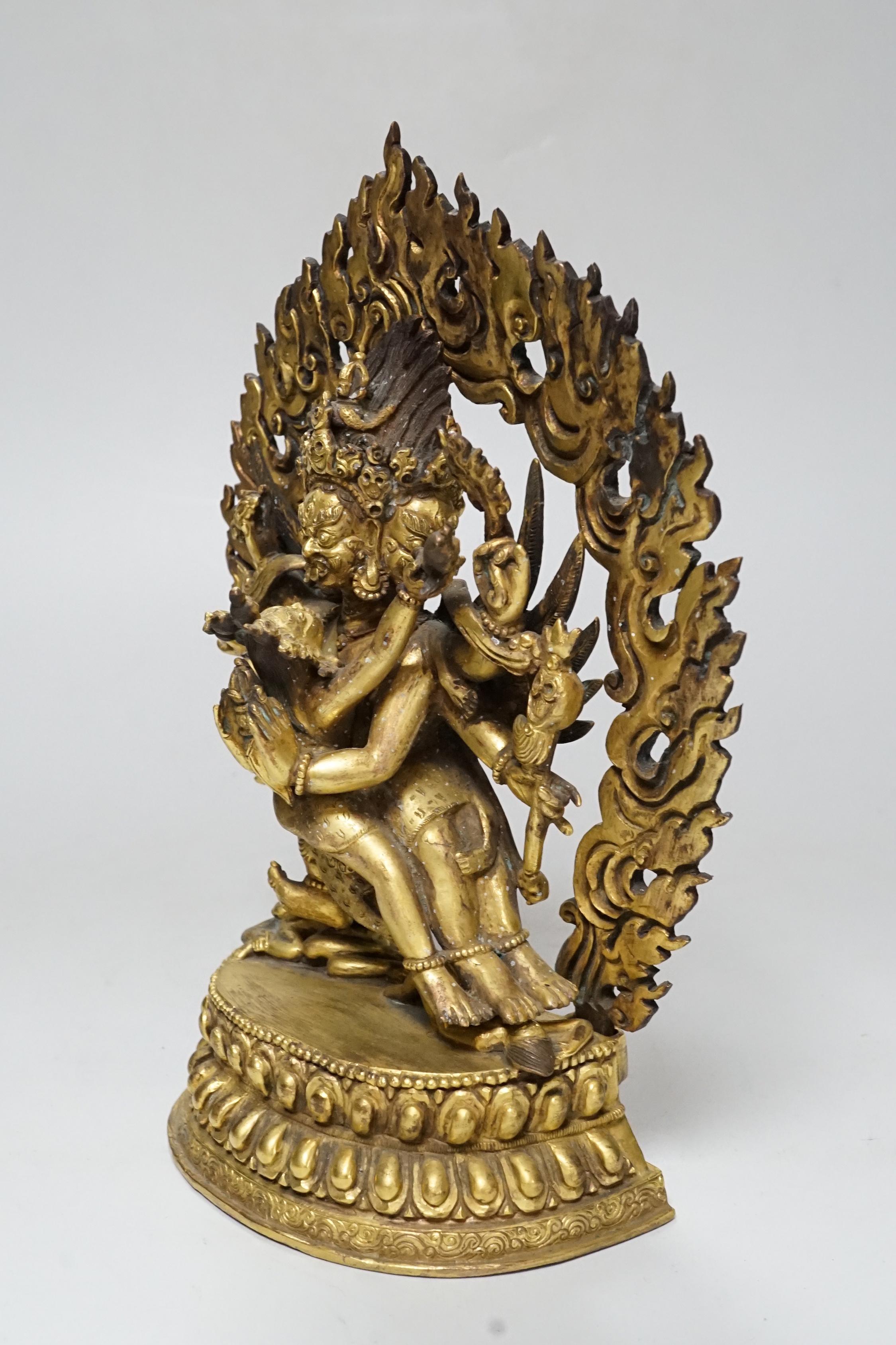 A Sino Tibetan gilt bronze group of Mahakala and consort, 22cm